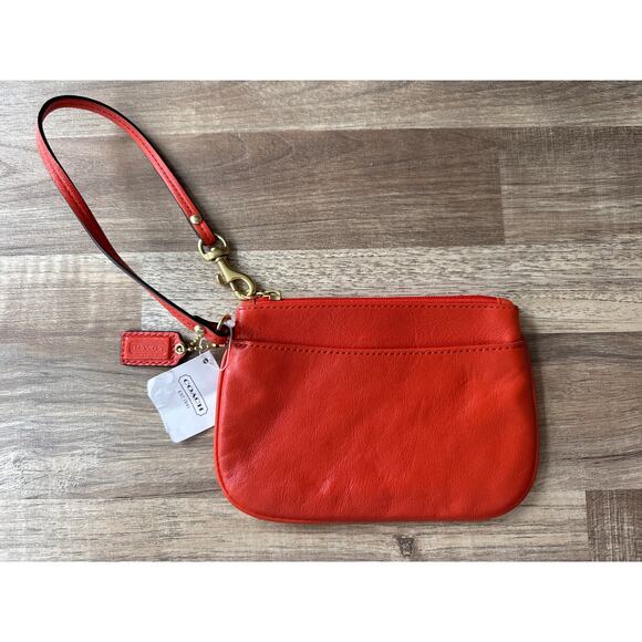 NWT Designer Coach F45651 Small Smooth Orange Leather Wristlet Boho Retro 70s - Picture 1 of 3